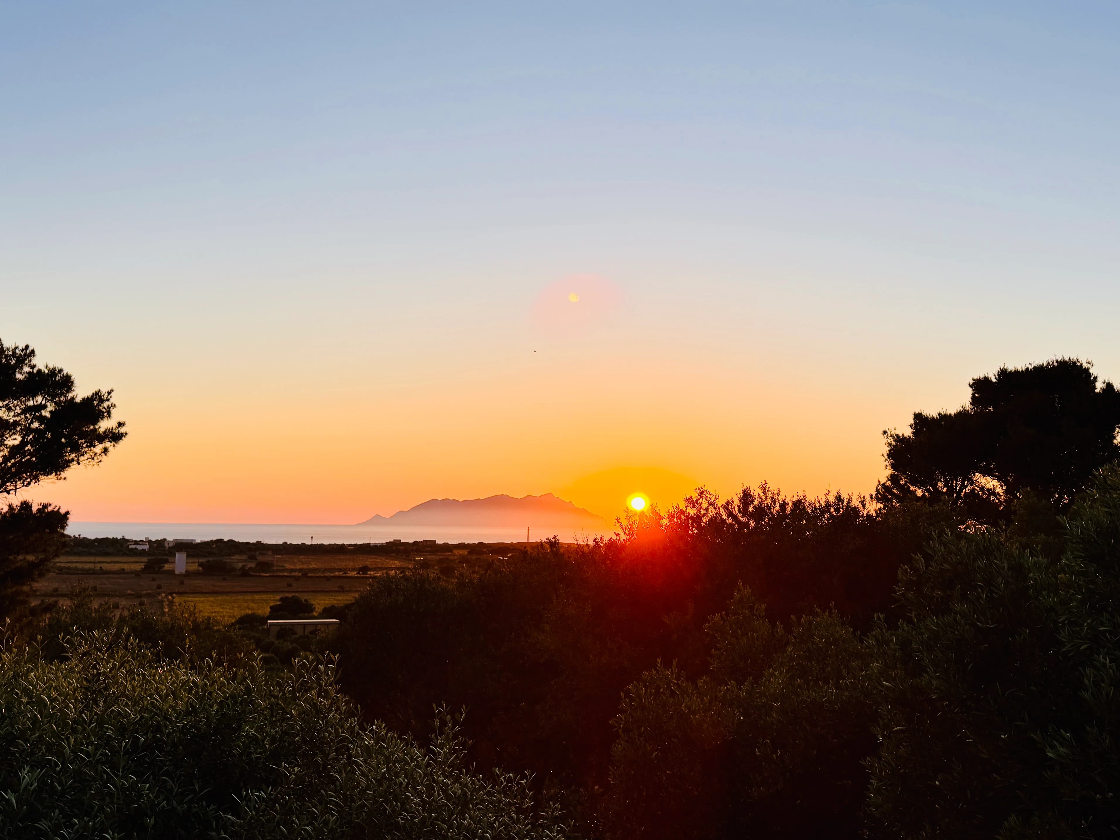 Golden sunset over the Italian coastline and countryside